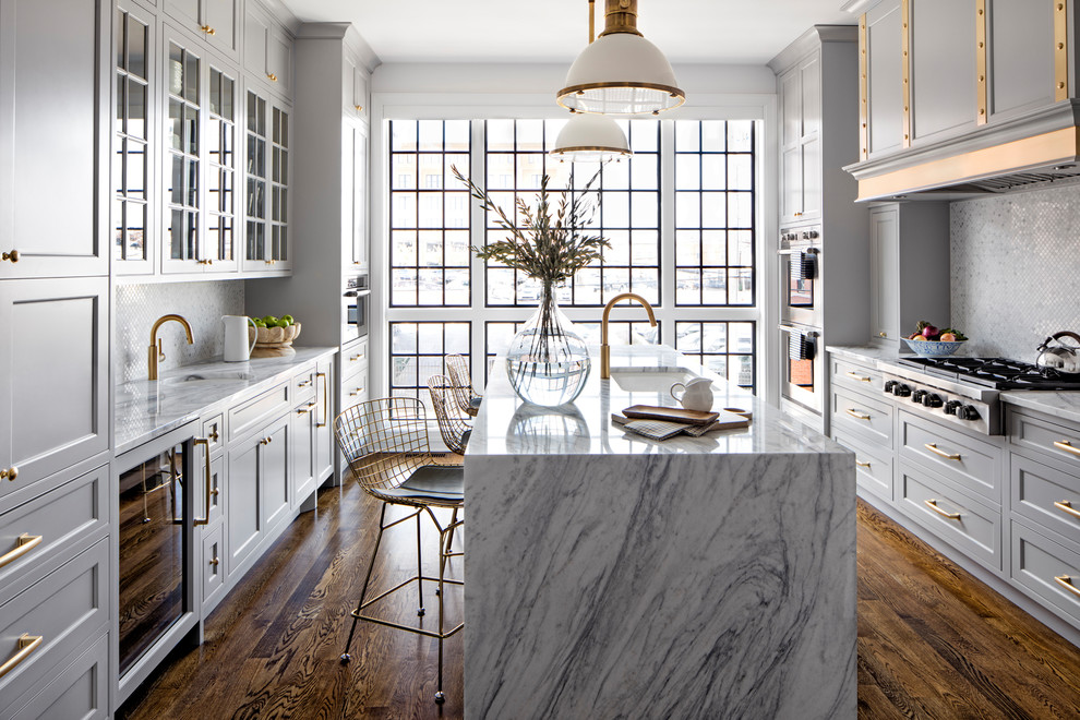 marble is a great choice for a waterfall countertop that helps to make a kitchen island looks like a work of art (Bria Hammel Interiors)