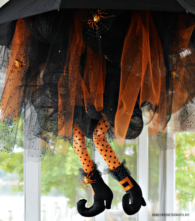 DIY Floating Umbrella Witch. 
Buy a pair of witch legs and reuse an old umbrella to create a beautiful hanging piece of decor. (via homeiswheretheboatis.net)