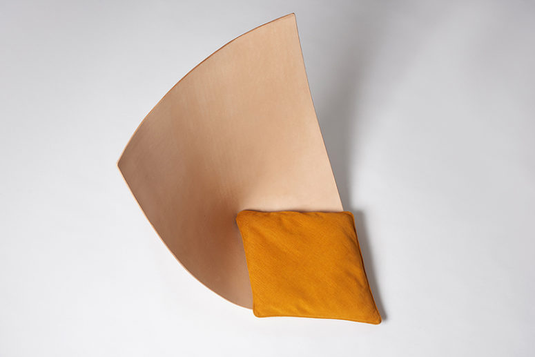Each chair is a single leather piece shaped as a seat, and there are matching pillows for comfort