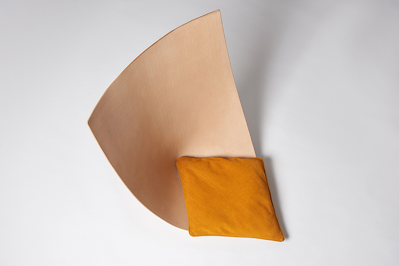 Each chair is a single leather piece shaped as a seat, and there are matching pillows for comfort