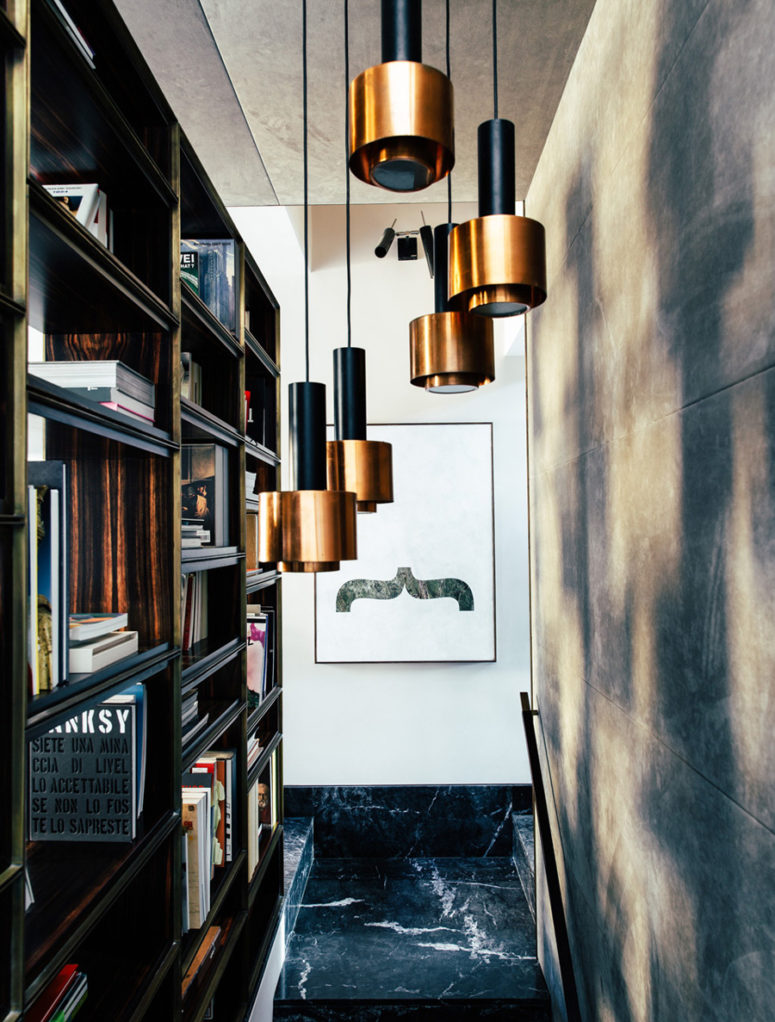 The architect used black marble in every space, and beautiful copper accents highlighted masculine decor
