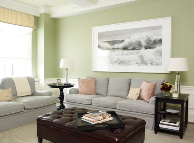 Very light grey sofas and green walls look cozy and family friendly