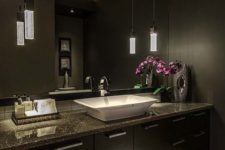 03 Asian-inspired space with dark cabinets and walls and chic pendant lamps