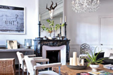 03 The living room blends classical antique French decor features, rough wood pieces and modern artworks