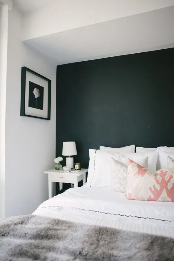 black headboard accent wall makes this niche cozier and more personal