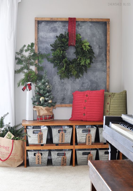 Hang an evergreen wreath and place faux tree for Christmas like entry