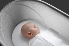 04 A cotton swaddle is designed to hold the baby in a sleeping position