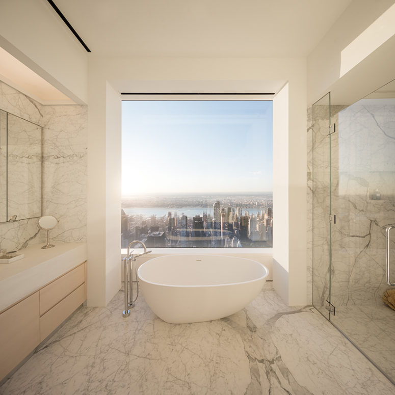 The master bathroom features an amazing view but seems simple but it's not because of adorable marble used for decor