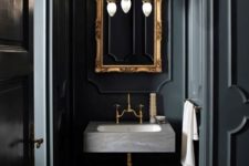 04 dark grey bathroom with a concrete sink and a refined framed mirror