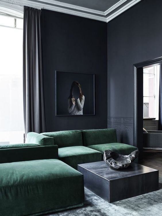 elegant graphite grey living room with an amazing emerald green sofa