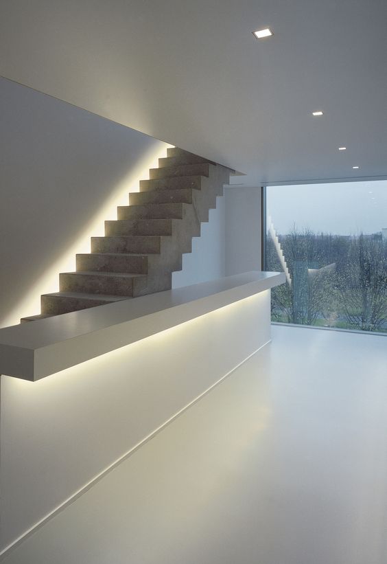invisible lighting makes this stairscase special and gives style to the room