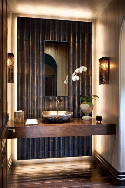 darker bathroom style with black bamboo decor, dark woods and hidden lights