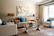 05 eclectic lviing room in calm brown shades with a couple of bold blue pillows
