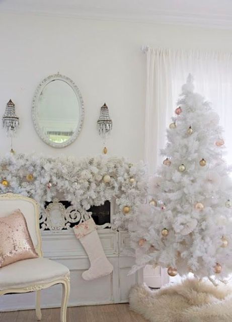 elegant vintage tree with gold ornaments and a garland over the mantel that echoes with it