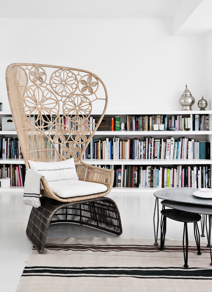 A woven boho chair stand out from this white glazing