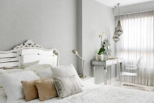 06 The bedroom is glam, with a mirrored bed and table and a cool lucite chair