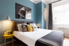 06 The bedroom itself is done in grey and accentuated with yellow and a blue headboard wall