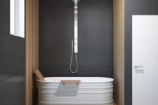 06 the bathroom is decorated in dark grey with addition of light wood