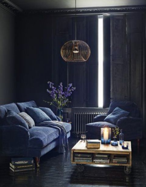 vintage sitting room with indigo furniture and traditional shutters