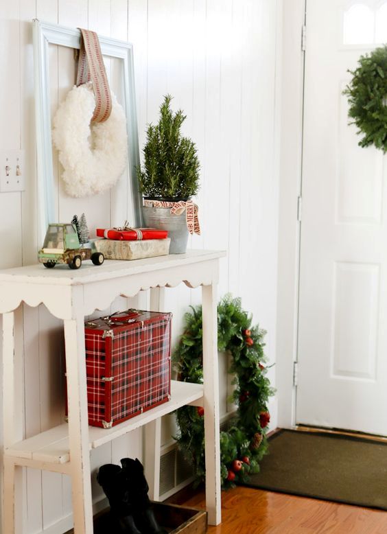 evergreen wreaths and gift boxes will create a festive mood