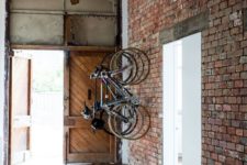 07 large entryway with an exposed brick wall that features bike holders