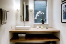 07 minimalist Japanese bathroom with white concrete walls and light woods