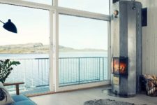 08 A hearth brings coziness in, and with a waterfront views next to it, it looks amazing