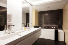 08 The master bathroom is done in white but there’s a gorgeous black marble panel installed behind the bathtub