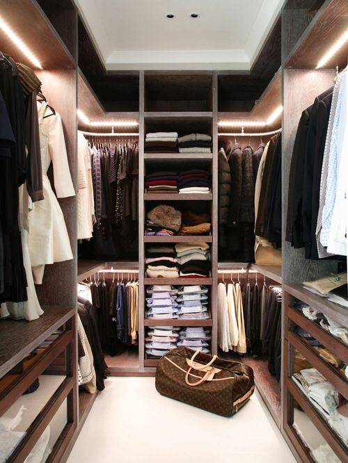 open shelves and rackks all over the closet to accomodate as much as possible