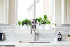 08 spruce up a white or ivory kitchen with a mother-of-pearl backsplash that is shining a bit