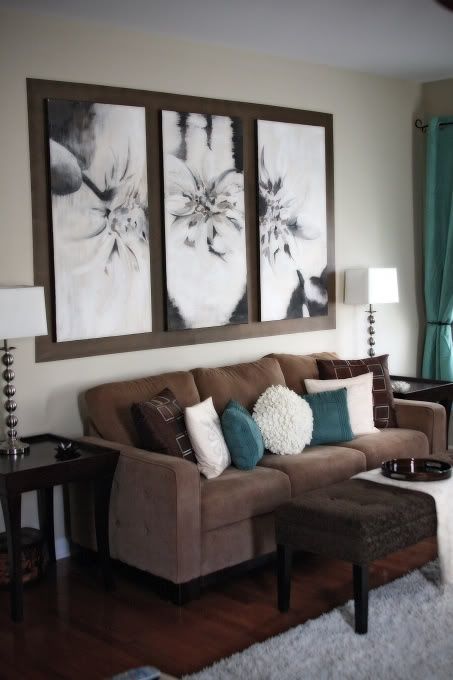 peaceful brown living room  with turquoise pillows and draperies