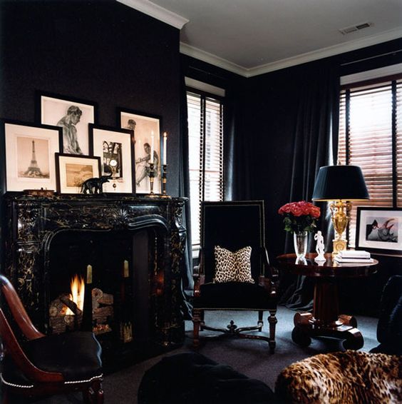 monochromatic black living room with leopard print touches