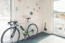 11 The entryway has a lot of light in due to a glass door and it features a bike stand