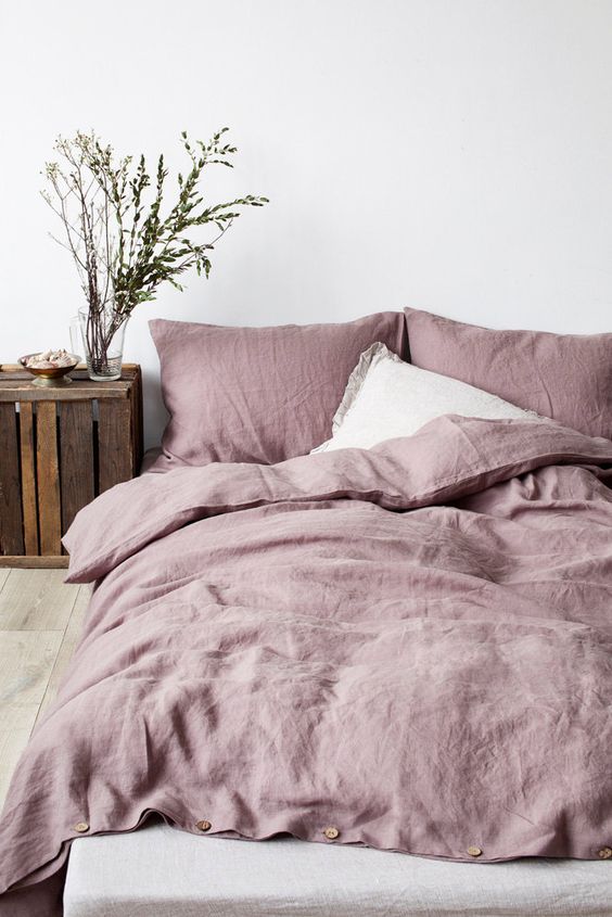 cozy pastel bedding for a rustic bedroom