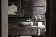 11 rustic bathroom with rough wood and stone decor