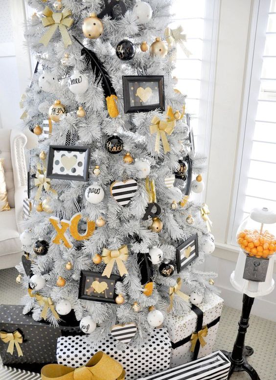 white tree with whimsy white, black and gold decor