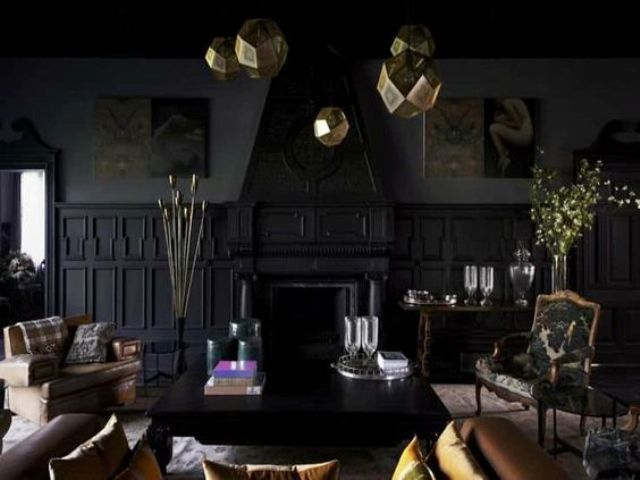 black living room with gold pendant lamps and vintage furniture