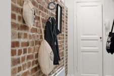12 brick walls are great for attaching various hooks and holders, so it’s a functional solution for an entryway