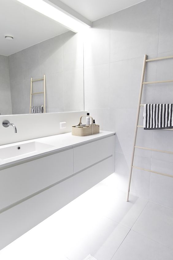 fill your white bathroom with light hiding some of them above