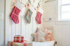 12 make your guests feel the coming of Christmas using a stocking garland and some gift-looking boxes