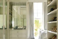12 mirror doors of the wardrobes will help to visually enlarge the space reflecting the light