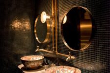 12 small black tiles, brass details and unique patterned sinks