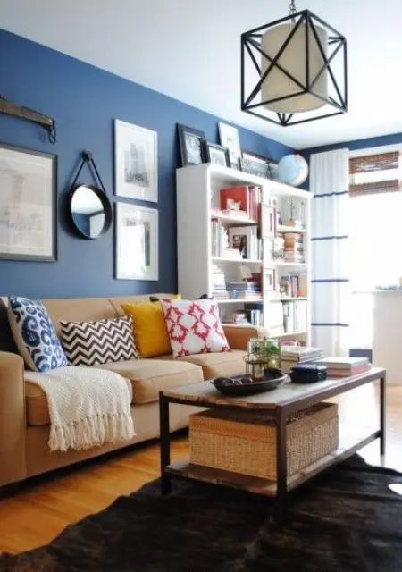 Brown and beige furniture, a bold blue accent wall for an eye catchy look