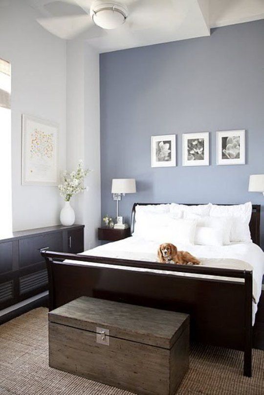 lavender accent wall gives this neutral bedroom a girlish feel