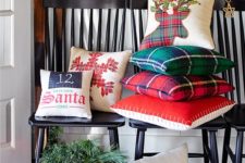 13 throw some Christmas-themed pillows and a holiday wreath to turn your entryway into a winter one