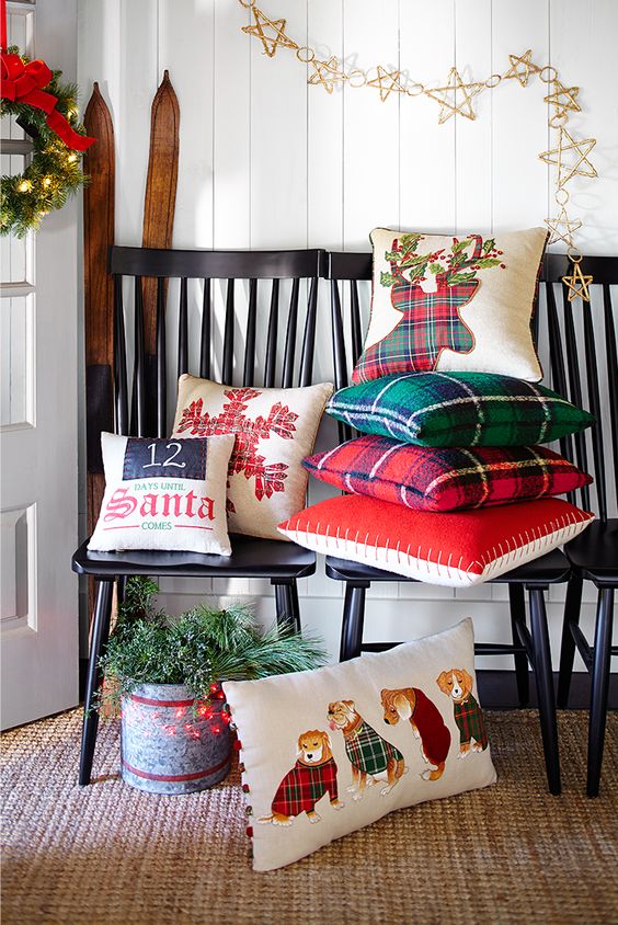 Throw some Christmas themed pillows and a holiday wreath to turn your entryway into a winter one