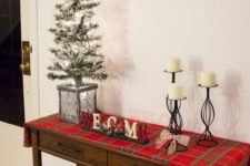 14 cover your console table with plaid fabric, add candles and a faux Christmas tree