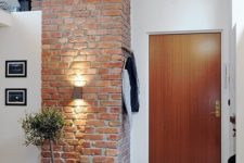 14 large brick pillar gives a stylish look to both the entryway and the kitchen next to it