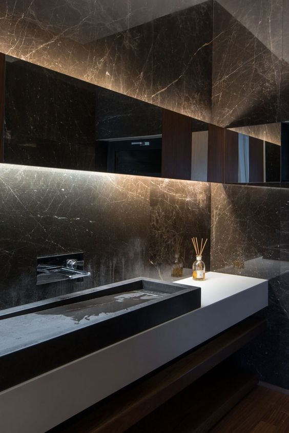 this moody space plays because of black marble walls