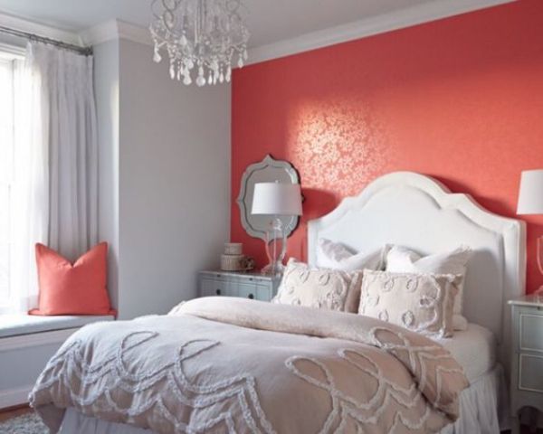 a coral accent wall will add a bit of passion to your bedroom